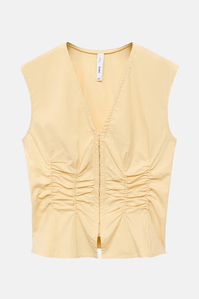 Gele mouwloze blouse van MANGO, met ritssluiting aan de voorkant en geplooid effect.