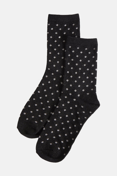 Chaussettes noires à pois scintillants de PIECES®, présentées sur fond uni.