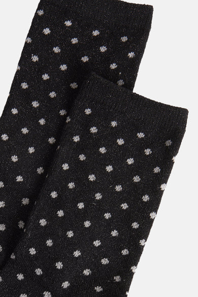Chaussettes noires à pois de PIECES®, texture tricotée avec fils scintillants.