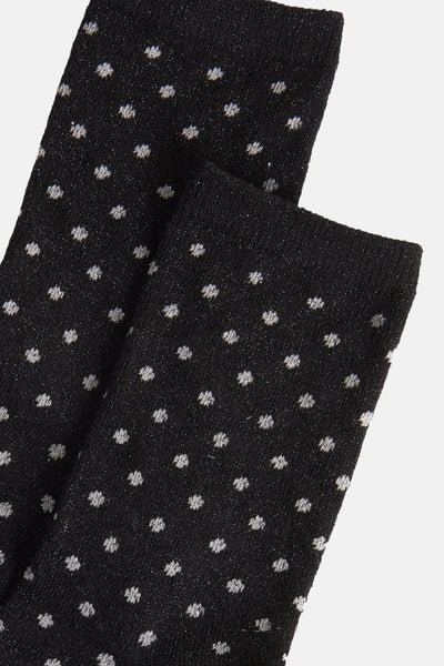 Chaussettes noires à pois de PIECES®, texture tricotée avec fils scintillants.