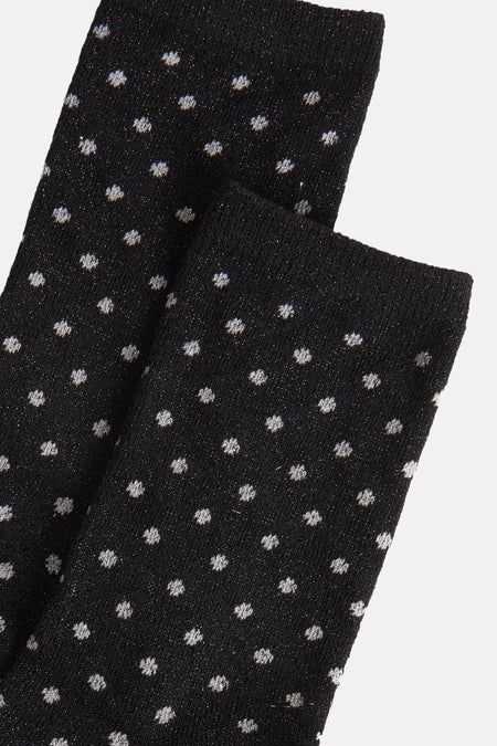 Chaussettes noires à pois de PIECES®, texture tricotée avec fils scintillants.