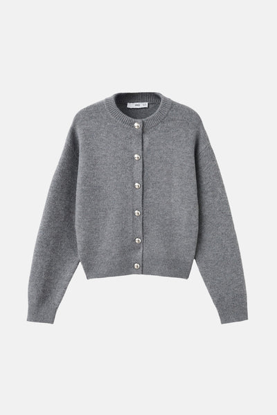 Gilet gris de MANGO avec une rangée de boutons argentés et des finitions côtelées.