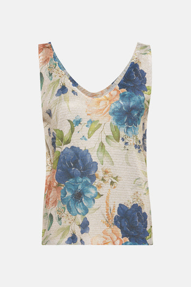 Blauwe tanktop van Terra di Siena met blauw en perzik bloemenpatroon op beige textiel.