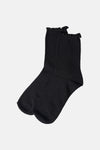 Black ribbed ankle socks with ruffled cuff, displayed front view on white background