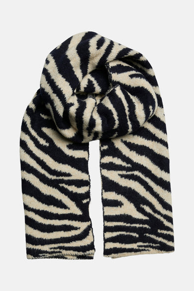 Écharpe multicolore par PIECES® avec motif zébré noir et beige, en maille texturée, enroulée sur elle-même.
