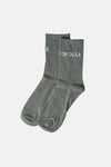 Dark green heathered ankle socks by FOFOLLE with white logo text on cuff, side view