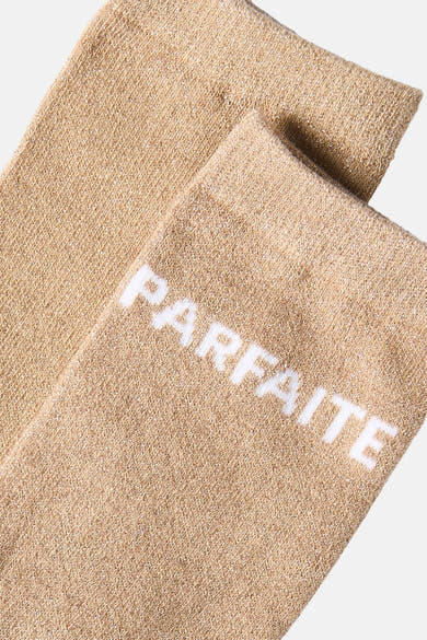 Natural beige socks with white "PARFAITE" text, soft knit texture, close-up view