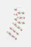 Witte fijngebreide sokken van PIECES® met een roze en groen bloemenpatroon.