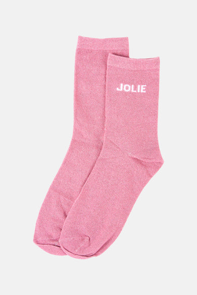 Roze glinsterende sokken van PIECES, met het woord 'MOOI' in het wit, op een effen achtergrond.