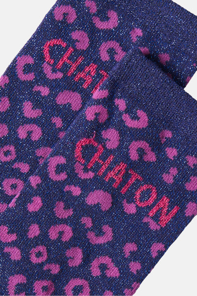 Maritime blue socks with pink leopard print and glittery texture, featuring bold "CHATON" lettering in red, close-up view