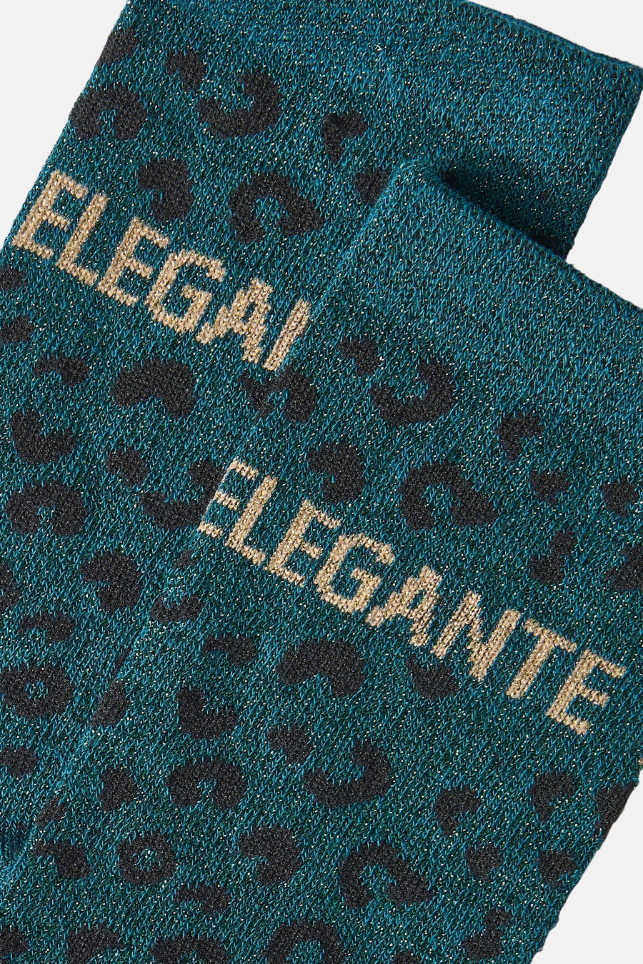 Teal shimmer socks with black leopard spots and gold "ELEGANTE" text, close-up view