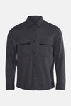Veste courte grise par MANGO, à manches longues, avec poches de poitrine et fermeture boutonnée.