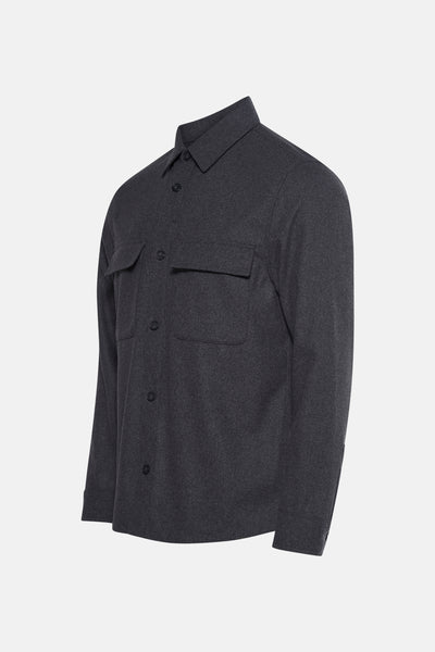 Veste courte grise de MANGO, avec poches à rabat et fermeture boutonnée.