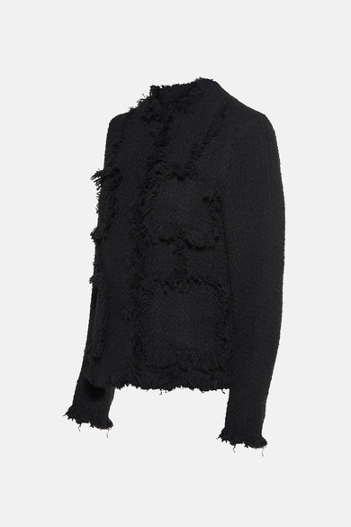 Blazer noir par MANGO, avec poches à bords francs et texture bouclée.