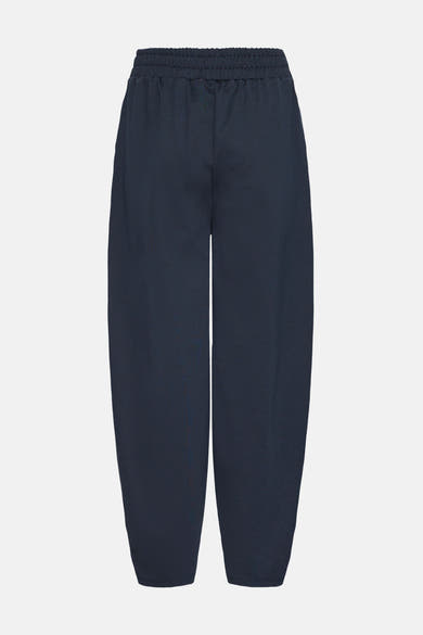 Navy blue relaxed-fit pants with elastic waistband by ICHI, featuring tapered legs and smooth fabric, front view.