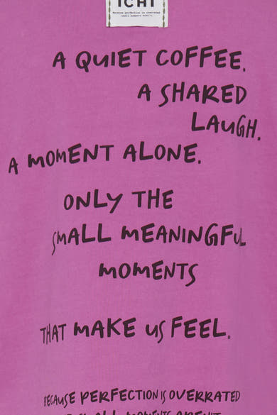 Pink short-sleeve t-shirt with handwritten-style black text, featuring phrases like "A quiet coffee" and "Only the small meaningful moments," close-up front view.