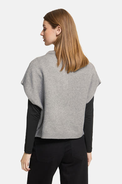 Grey knit débardeur by ICHI, back view, featuring short batwing sleeves and ribbed hem, worn with black long-sleeve top and pants.