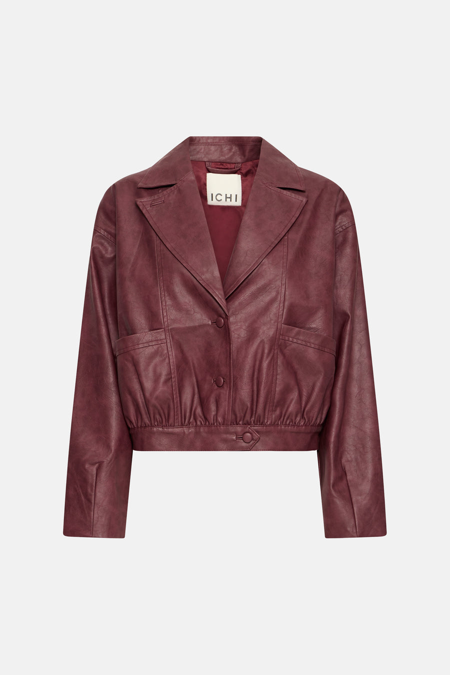 Burgundy faux leather cropped jacket by ICHI with notched lapel, front buttons, and side pockets, shown front view
