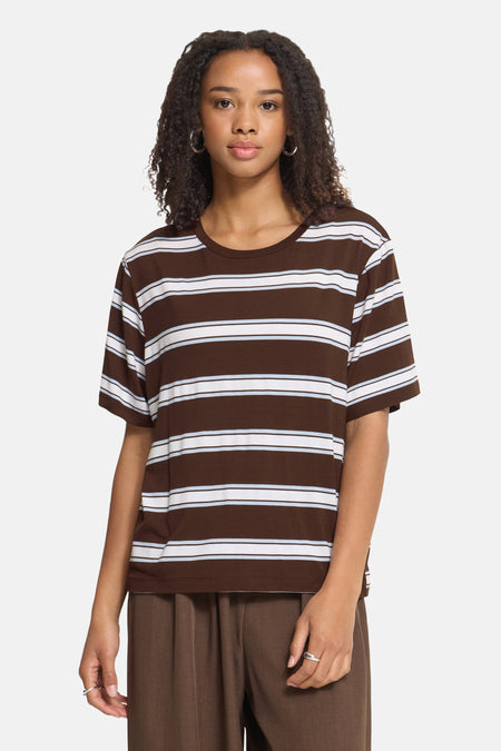 Brown and white striped short-sleeve T-shirt with round neckline, worn by model in front view, featuring relaxed fit and soft fabric texture.