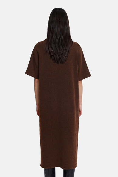 Brown short-sleeve knit dress from back view, oversized fit with textured fabric and straight hemline