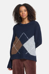 Multicolored O-neck sweater with navy, brown, and gray argyle pattern, textured knit, front view on model wearing corduroy pants