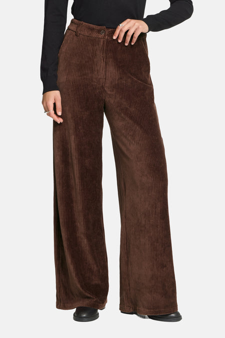Brown corduroy wide-leg suit pants by ICHI, front view, ribbed texture, high waist, black top and shoes worn