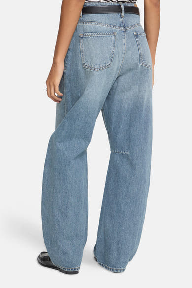 Mid blue denim wide-leg jeans by ICHI, back view with classic stitching and relaxed fit, worn with black belt and loafers