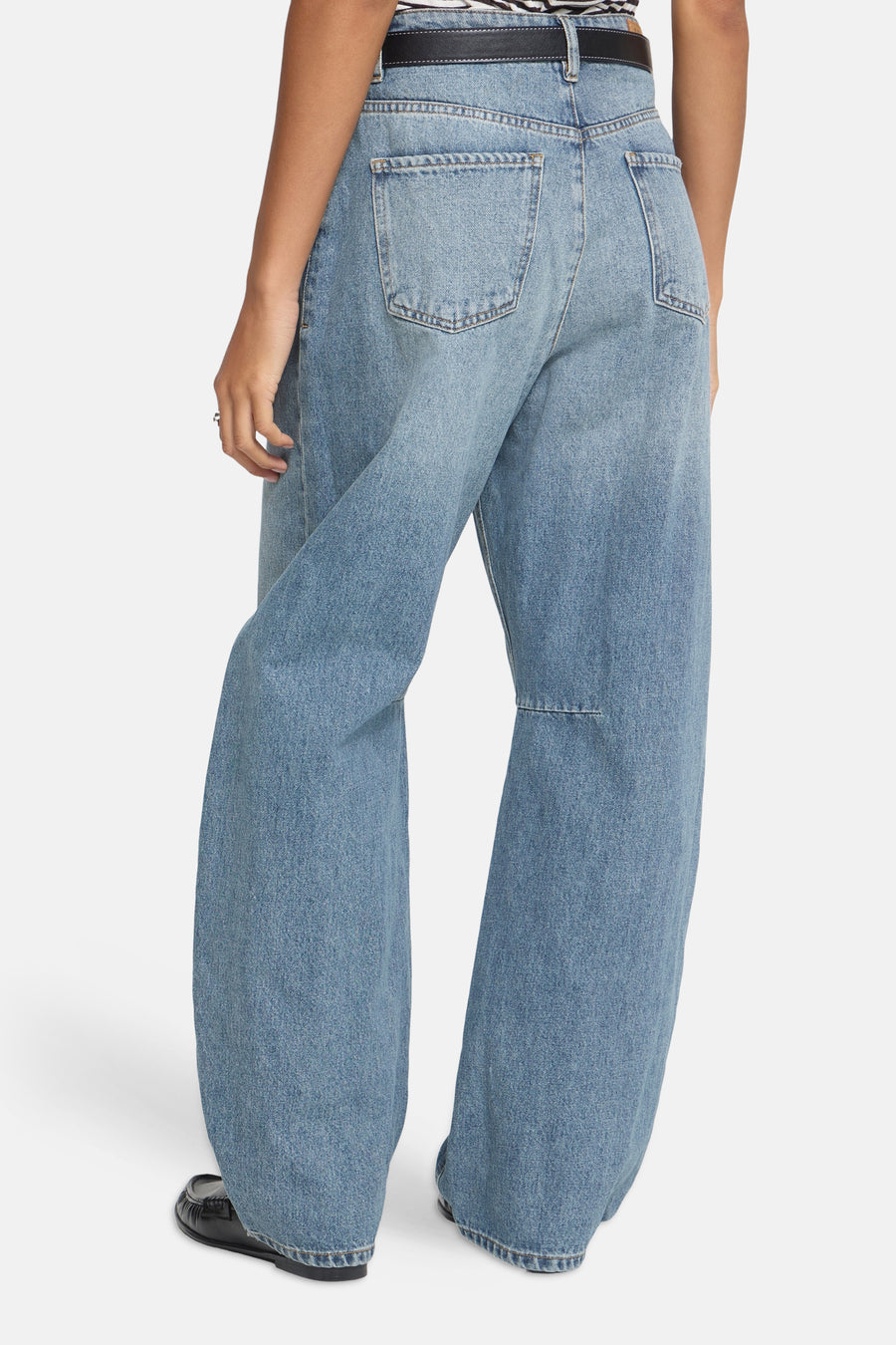 Mid blue denim wide-leg jeans by ICHI, back view with classic stitching and relaxed fit, worn with black belt and loafers