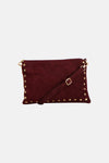Burgundy suede crossbody bag with gold-tone studs and adjustable strap, front view