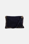 Navy blue suede crossbody bag with gold-tone studs and adjustable strap, front view