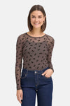 Brown long-sleeve sheer blouse with black bow pattern by Fransa®, worn with dark blue jeans, front view.