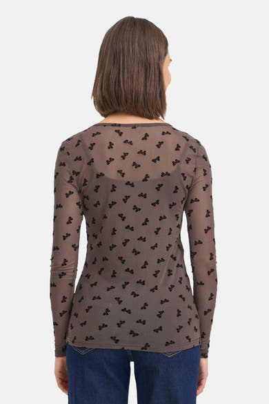 Brown long-sleeve chemisier with black bow pattern by Fransa® shown from back view on model wearing blue jeans