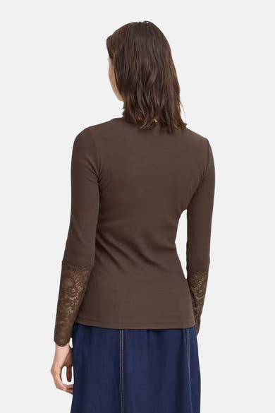 Brown long-sleeve ribbed t-shirt with lace cuffs, back view, worn with navy skirt