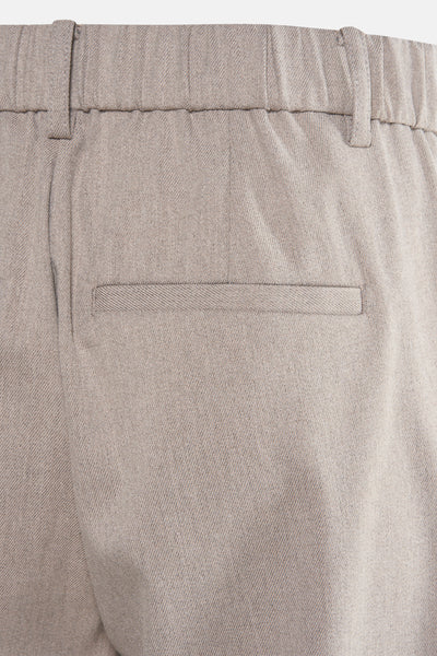 Pantalon beige de Fransa, avec une taille élastique et une poche arrière passepoilée discrète.