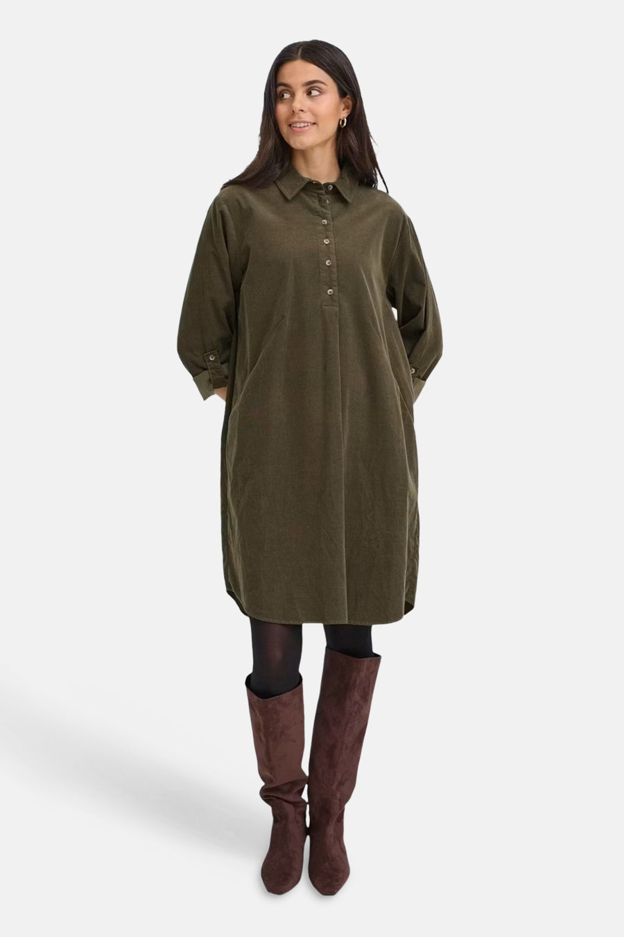 Khaki long-sleeve corduroy dress with button-down front and collar, worn with black tights and brown suede boots, full-length front view