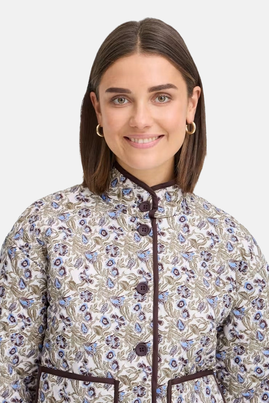 Multicolored floral-patterned women's casual jacket with brown buttons and stand collar, front view