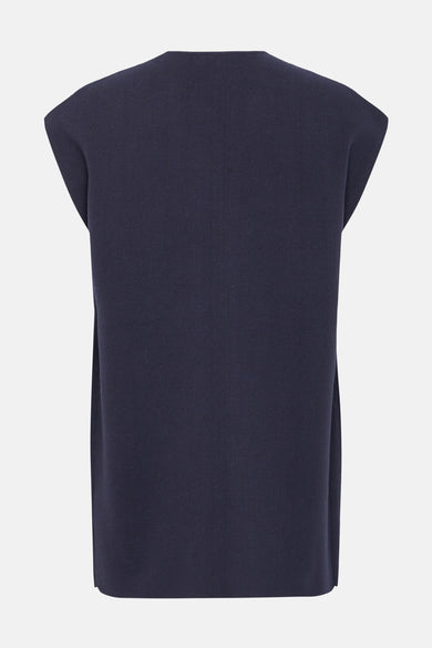 Cardigan bleu de Fransa, en maille texturée, sans manches, présenté de dos.