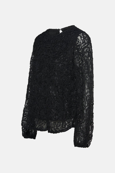Blouse noire à manches longues de Fransa, avec motif de dentelle floral et texture délicate.

