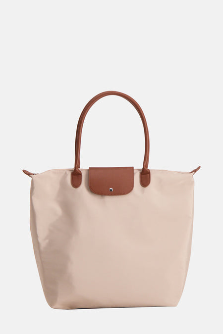 Sac à bandoulière beige de Fransa, avec des poignées et un rabat marron.
