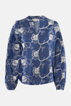 Blouse bleue à manches longues de Fransa, avec motif fleuri blanc et encolure en V.
