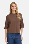 Brown O-neck sweater with three-quarter sleeves and ribbed hem, worn with blue jeans, front view
