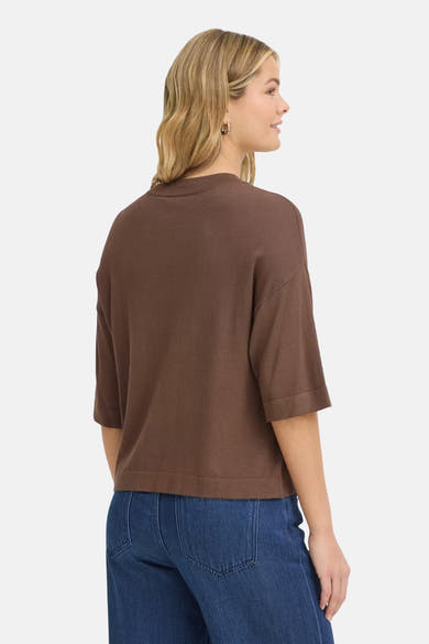 Brown O-neck sweater with ribbed trim and three-quarter sleeves, side view on model wearing blue jeans