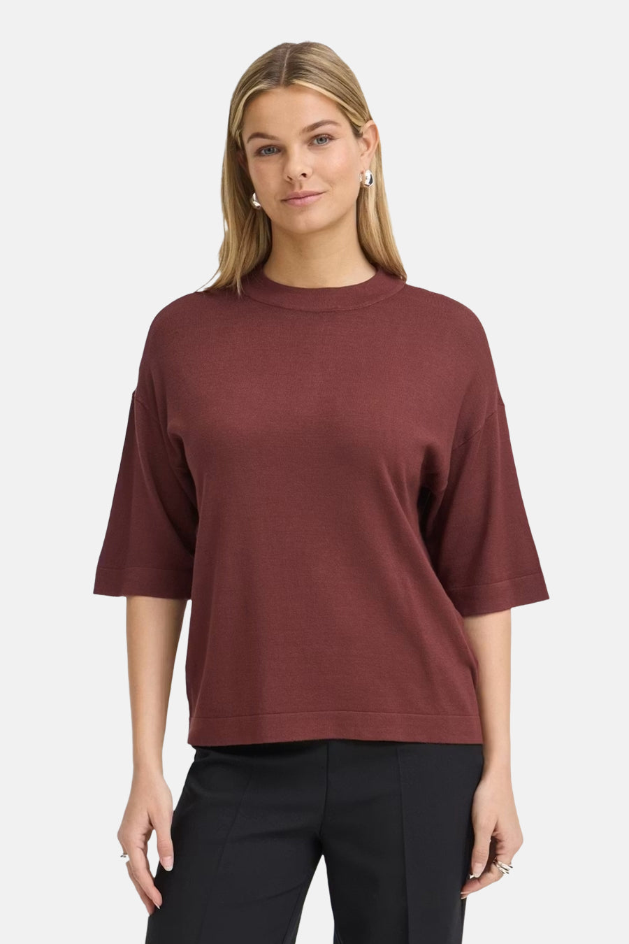 Burgundy round-neck sweater by Fransa® with ribbed trim, three-quarter sleeves, and relaxed fit, worn with black trousers in front view.