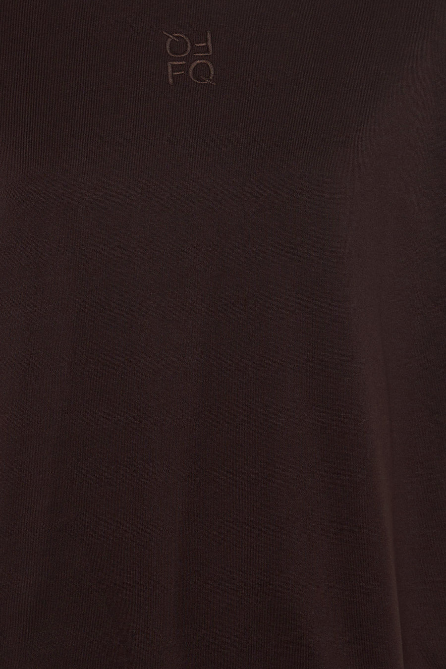 Brown short-sleeve t-shirt by FQ with subtle embroidered logo on chest, close-up view