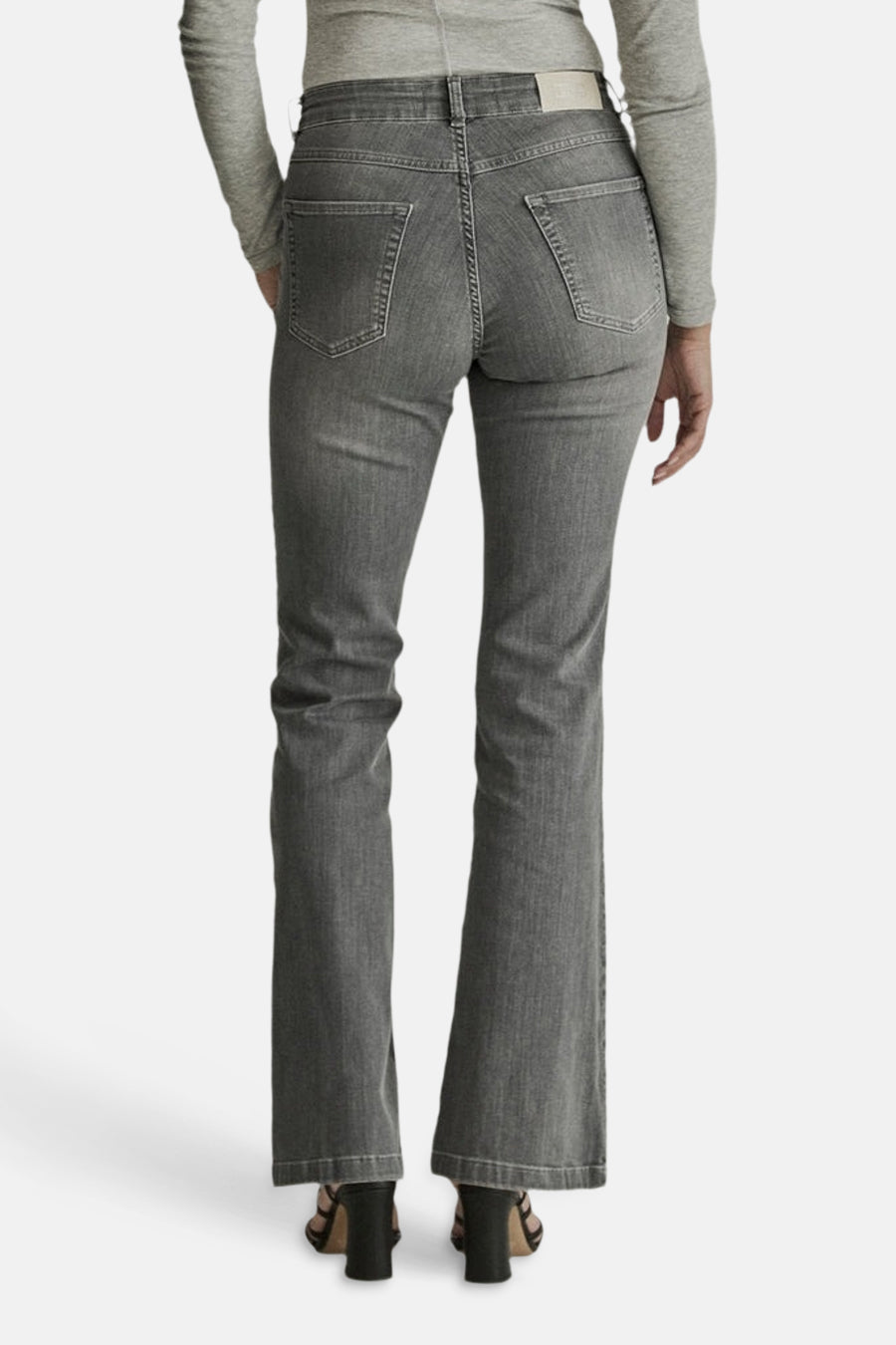 Light grey flared jeans by JADE, back view showing classic stitching, two rear pockets, and a straight-to-flare leg silhouette.