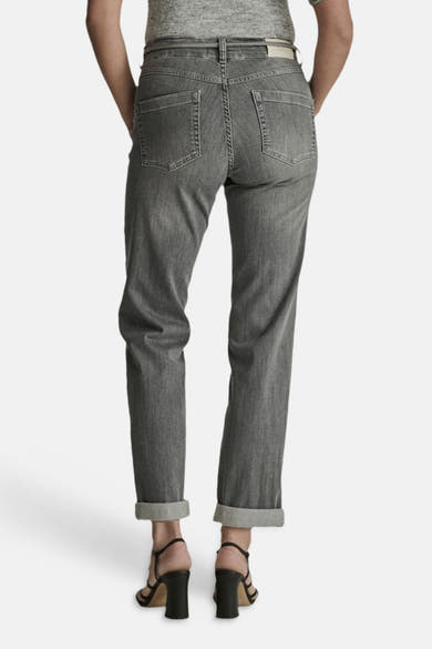 Light grey straight-leg jeans by BOBBY, back view with cuffed hems and classic stitching, worn with black strappy heels