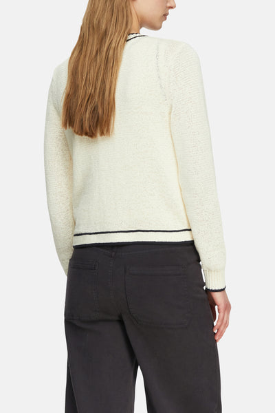Gilet beige de COMMA, avec garniture noire et détail tricoté, vu de dos.