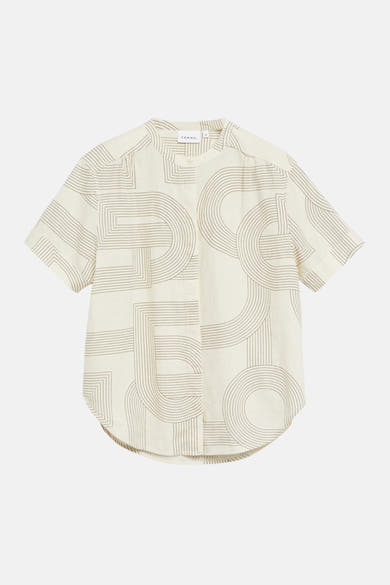 Blouse beige à manches courtes de COMMA avec un motif géométrique de lignes et arcs, col officier et ourlet arrondi.