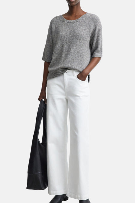 Brown crewneck sweater by COMMA, textured knit with ribbed hem and cuffs, worn with white wide-leg pants and black tote bag, front view.