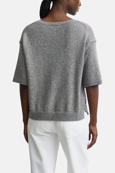 Brown crewneck sweater by COMMA, back view, heathered knit texture, short sleeves, ribbed hem and cuffs, worn with white pants